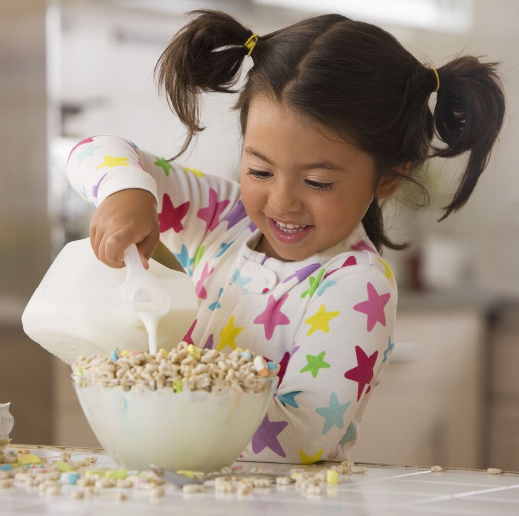 Group Of Kids Eating Cereal